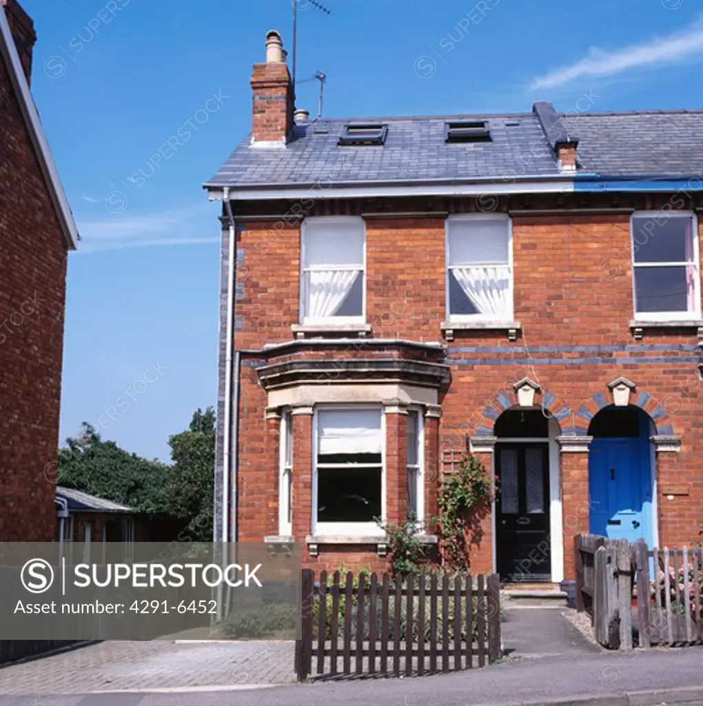 Red brick semi-detached Victorian house