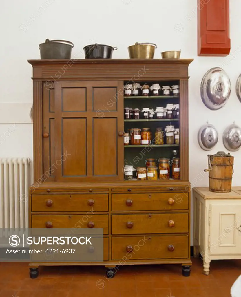 Preserves and jams stored in antique kitchen dresser