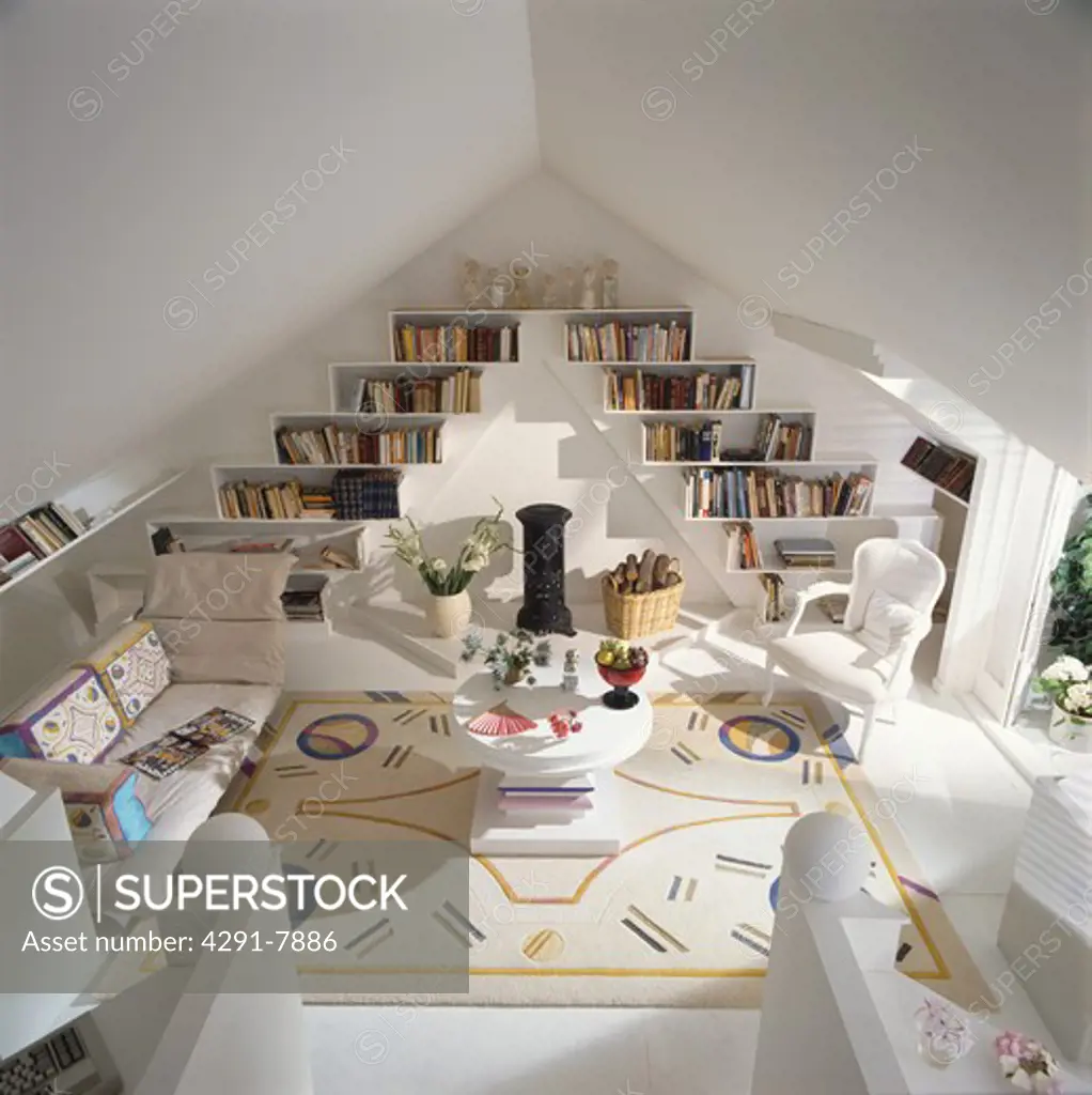 Abstract patterned cream carpet in eighties attic living room with pyramid shelving on either side of cylindrical black stove