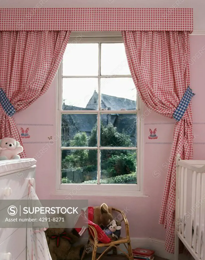 REd check gingham curtains with blue gingham tiebacks in baby's nursery bedroom