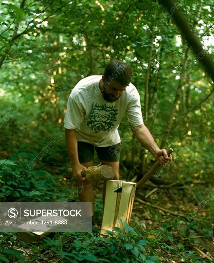 Man splitting wood in the Forest of Dean before making wooden chairs by the ancient art of bodging
