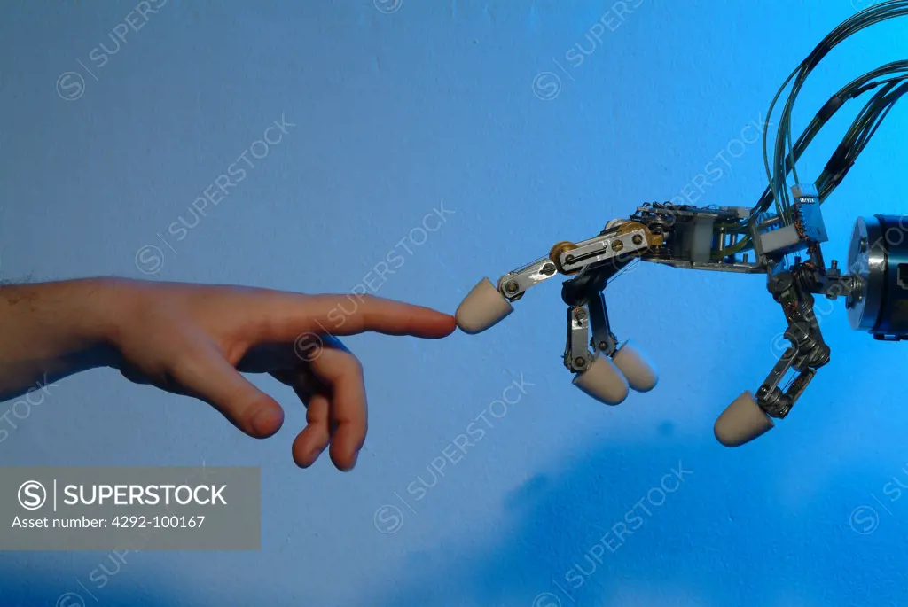 Italy, Genoa, robot hand touching human hand in the Lira Lab, of Genoa University