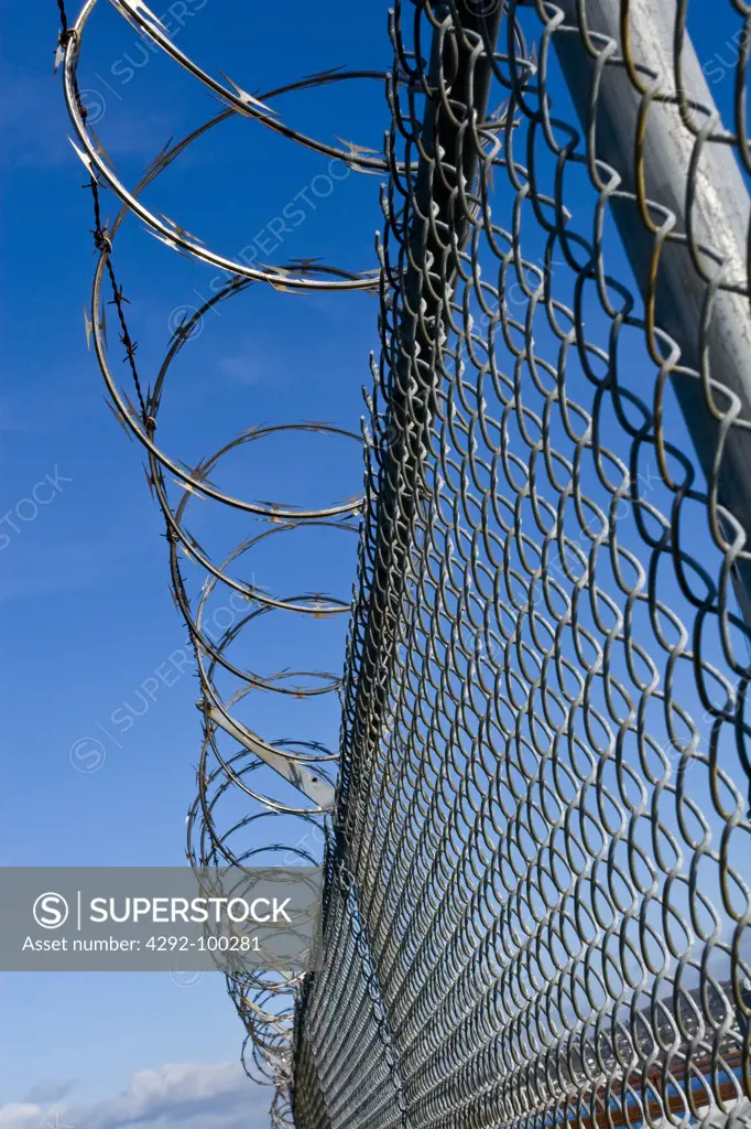 Fence with razor wire on top