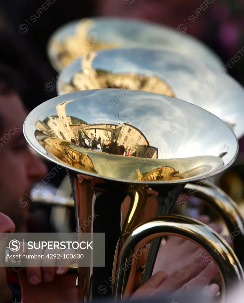 Italy, Umbria, Gubbio,Festa dei Ceri, detail of  musicians playing trumpet