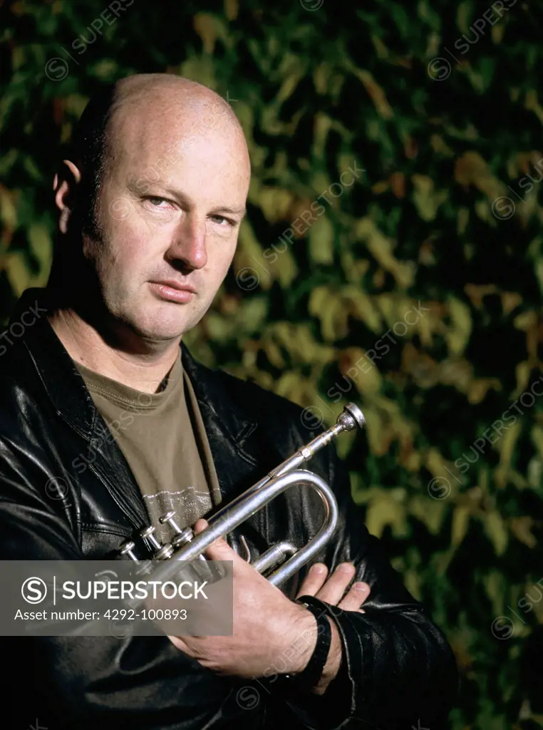 Portrait of a musician holding trumpet
