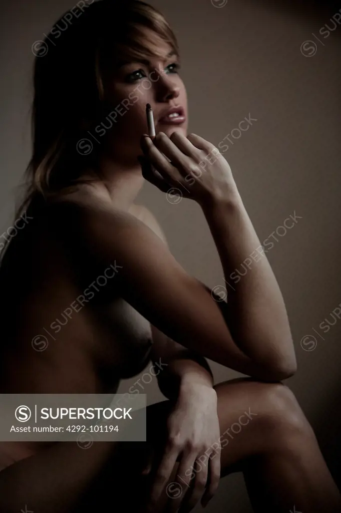 Naked woman with cigarette