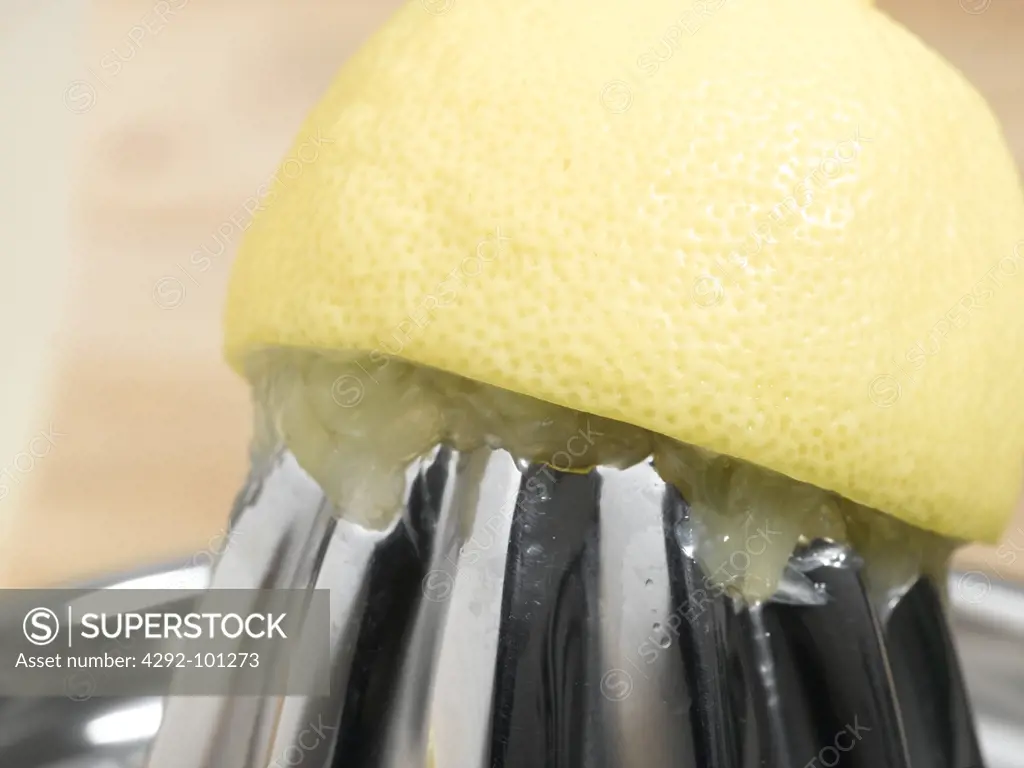 Lemon on juicer, close up
