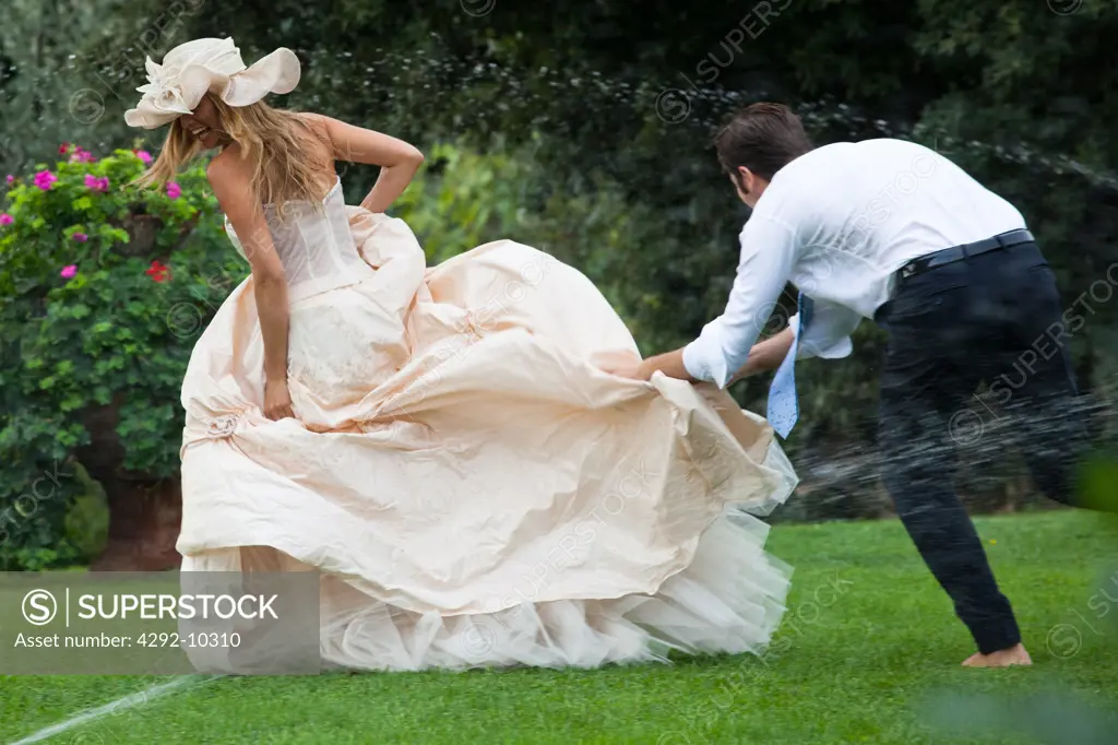 Bride and groom playing