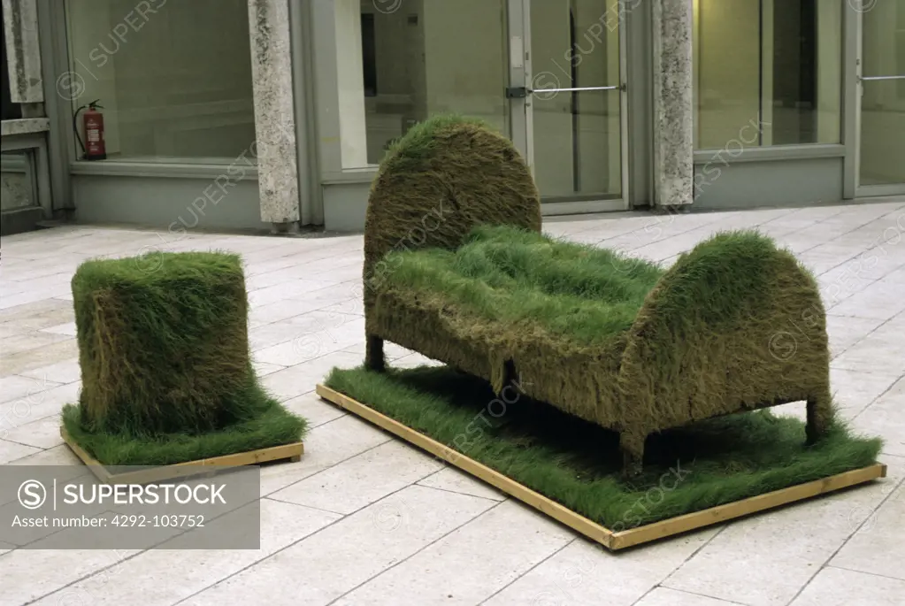 Uk,England, London. Bed and bedside table made of grass