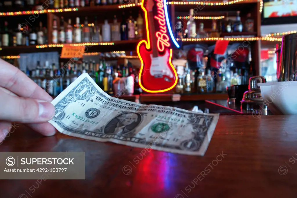 Man paying in a bar
