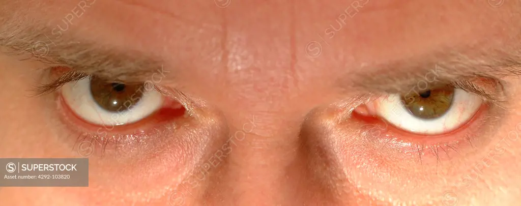 Man with brown eyes close up