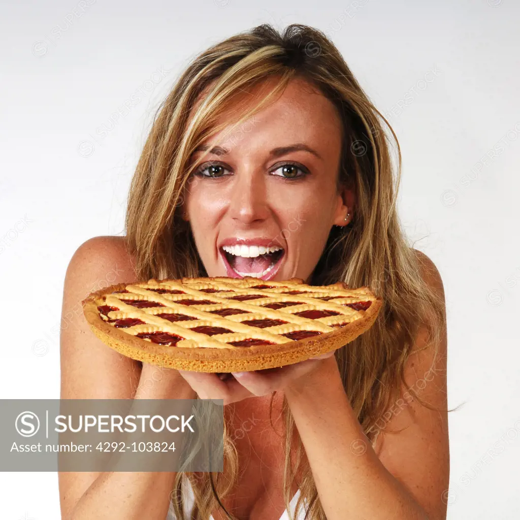 Woman eating fruit cake
