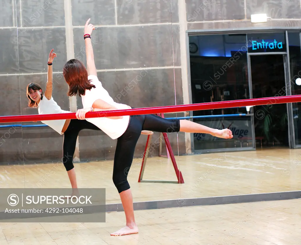 Dancer training in ballet studio