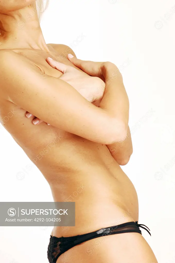Studio shot of a topless woman wearing panties