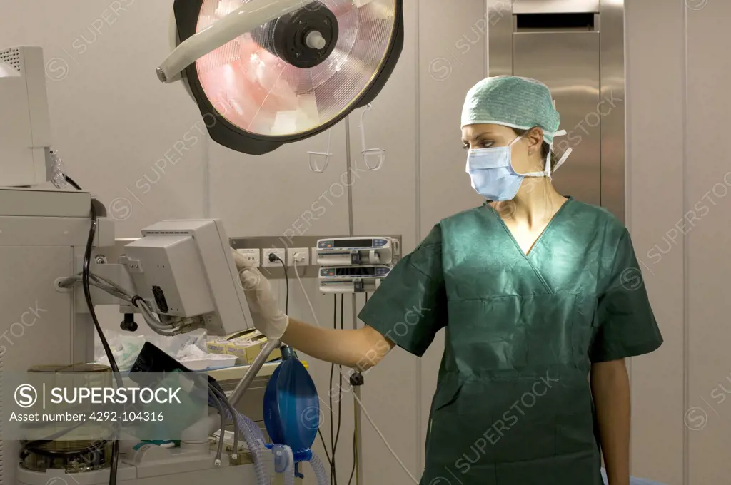 Female doctor wearing surgical mask in operating room