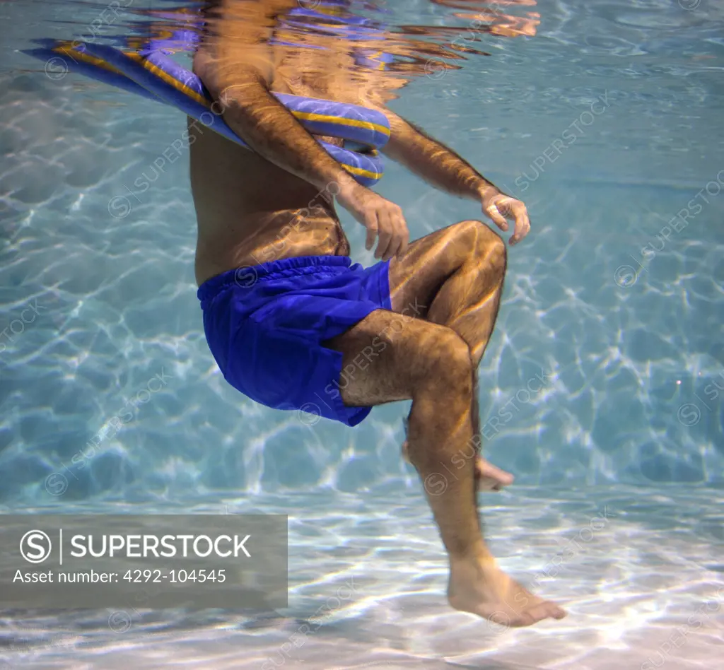Man in swimming pool for rehabilitation
