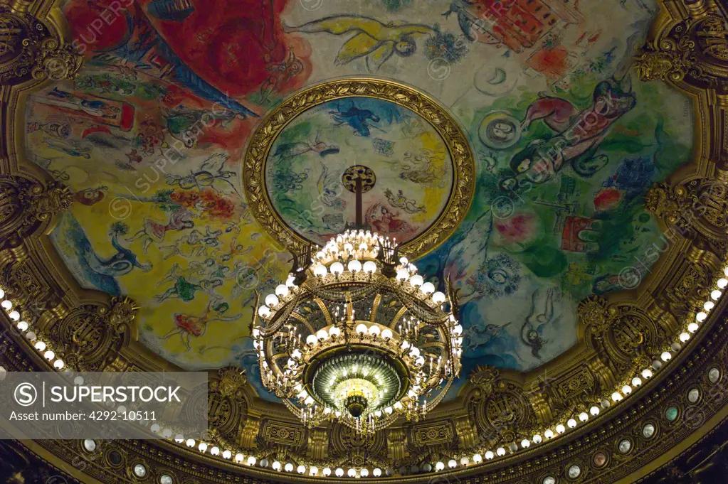 France, Paris, the crystal chandelier and ceiling painting Apollo with the lyre by Marc Chagall in the dome, Salle de Spectacle auditorium, Opéra Palais Garnier