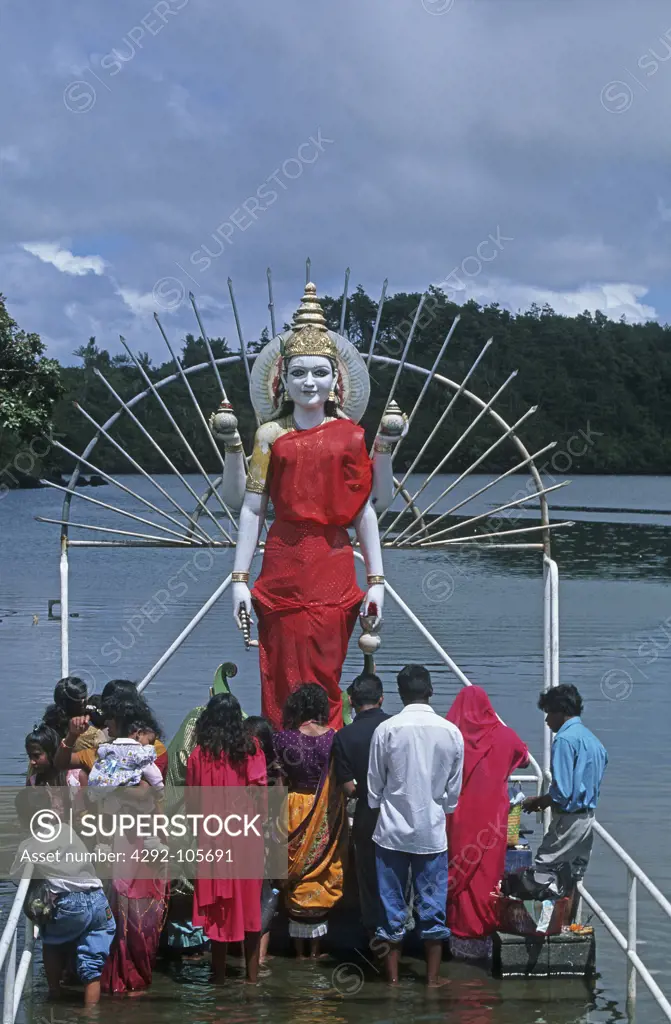 Africa, Mauritius, Grand Bassin. People in front of Shiva statue