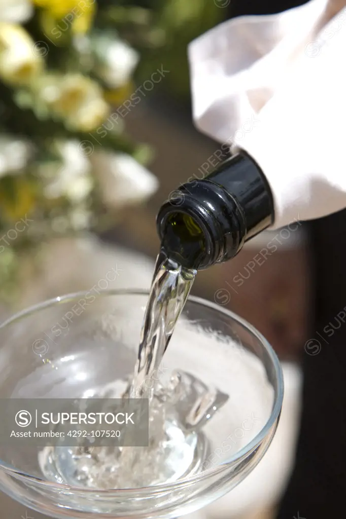Champagne being poured into a champagne flute