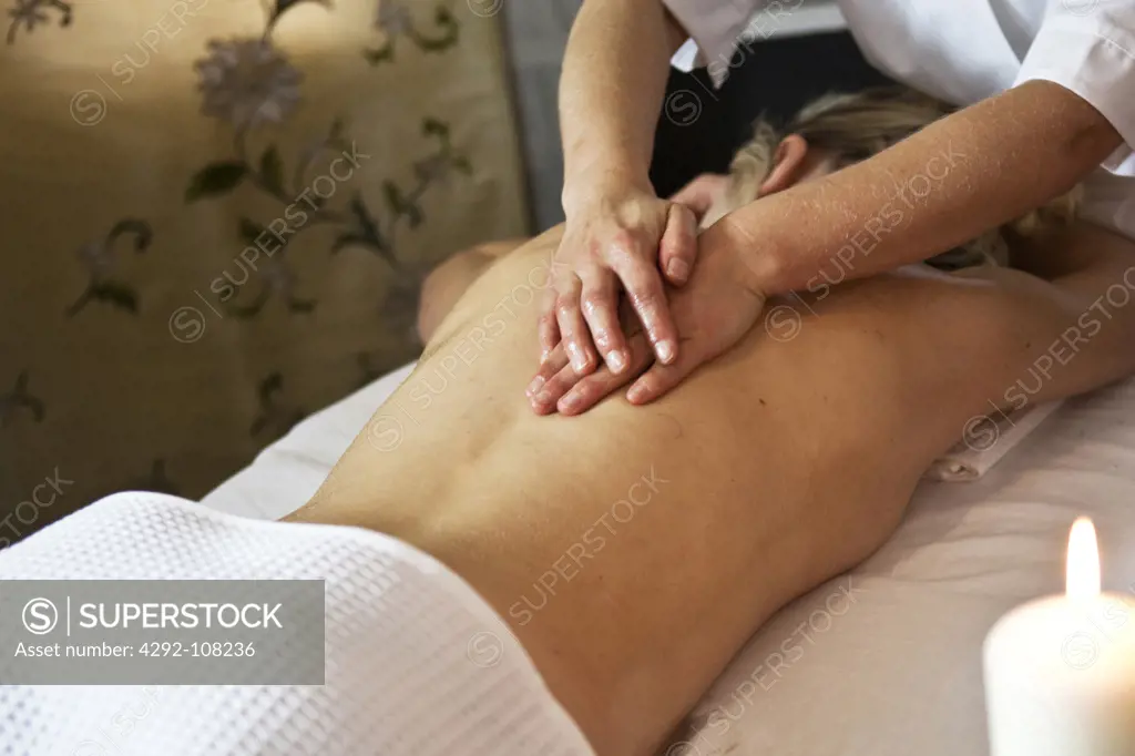 Woman having oil massage treatment