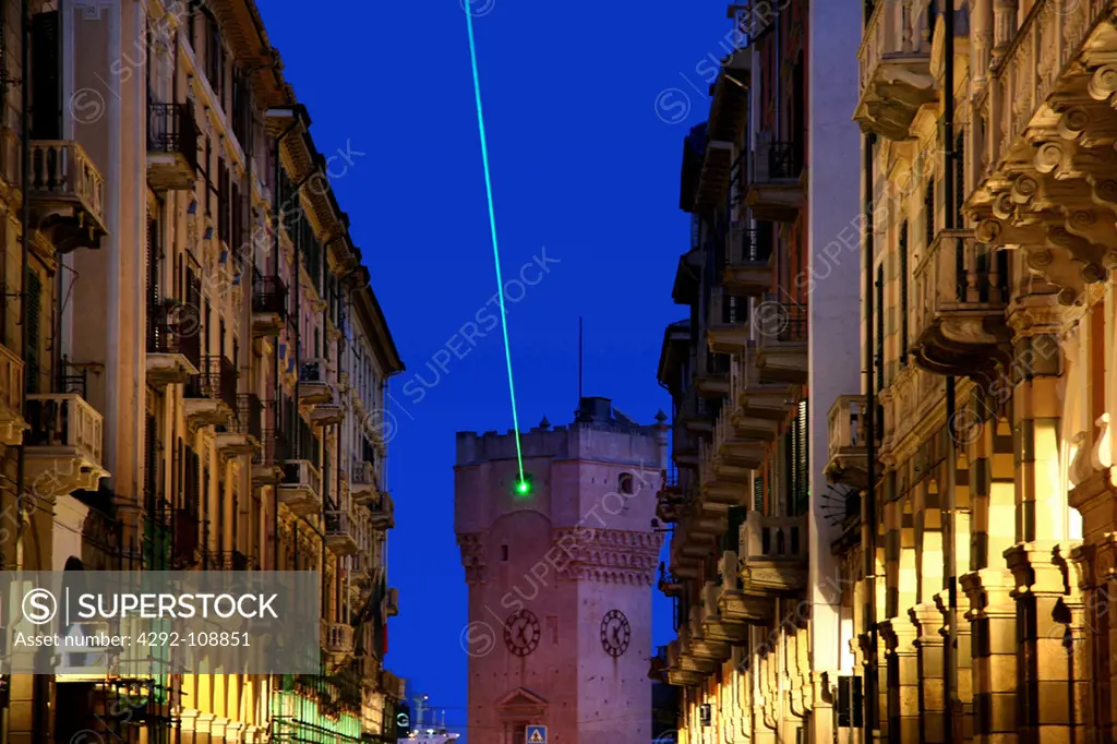 Italy, Liguria, Savona at dusk illuminated for Christmas 2007 (lights by Studio Ravelli Milano), green laser light from tower
