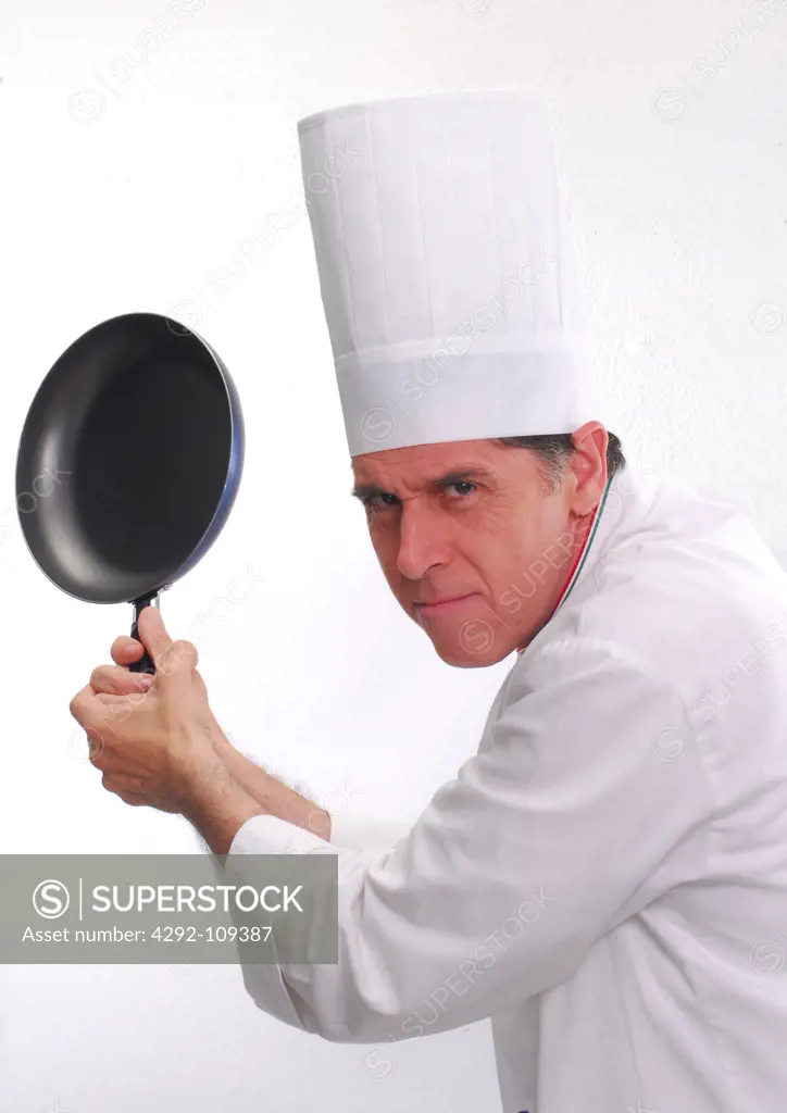 Portrait of a playful male chef with pan