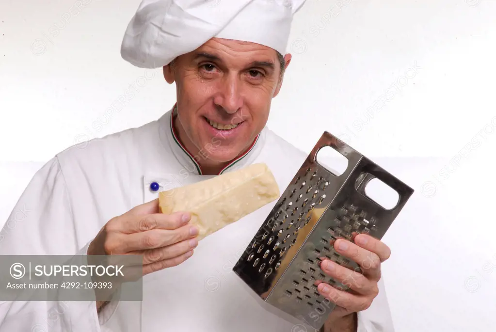 Portrait of male chef with grater and parmesan cheese