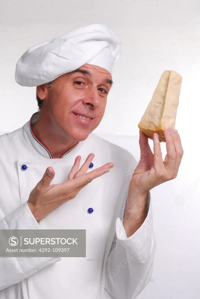 Portrait of male chef with parmesan cheese