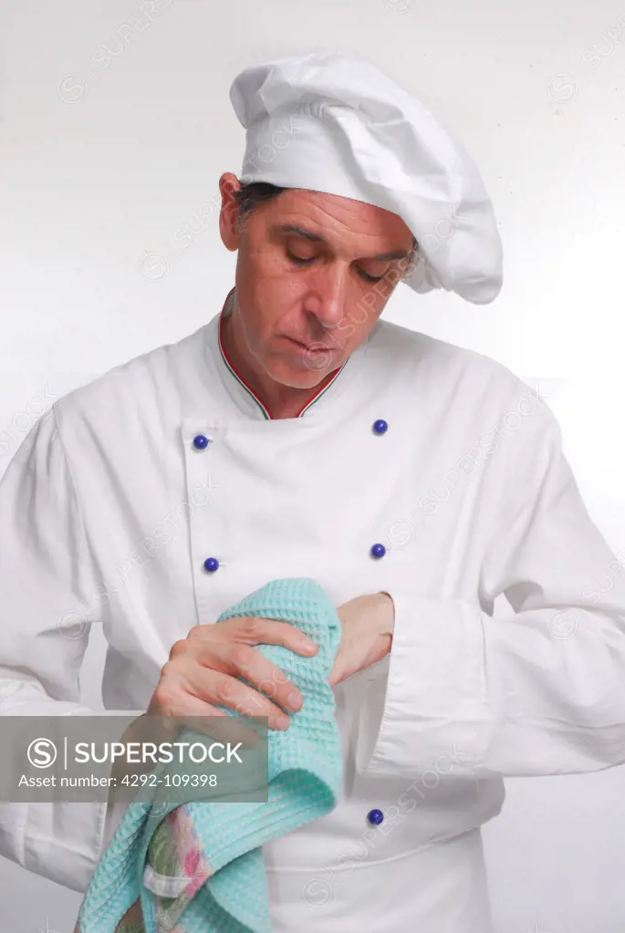 Male chef drying his hands