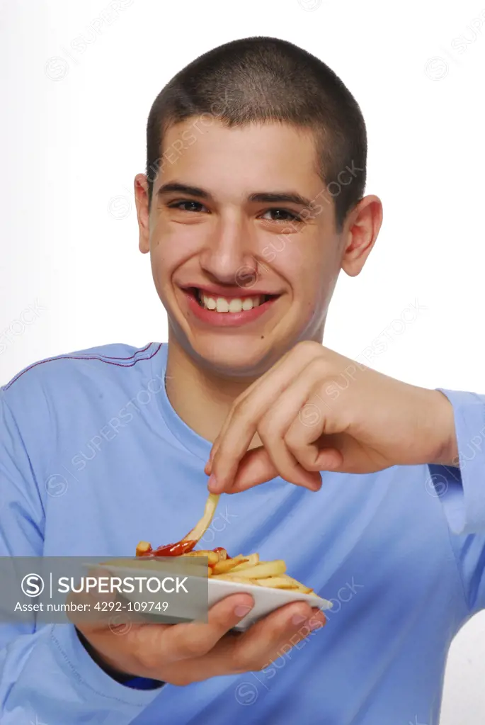 Teenage boy with french fries