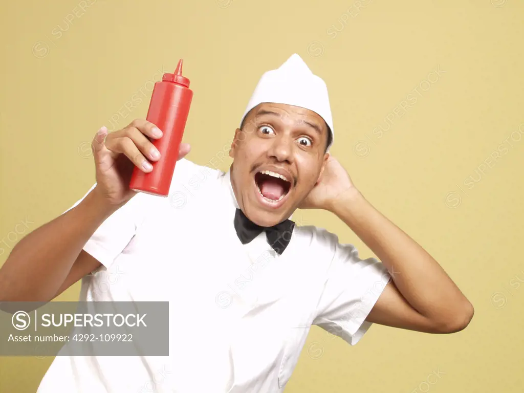 Waiter with ketchup bottle