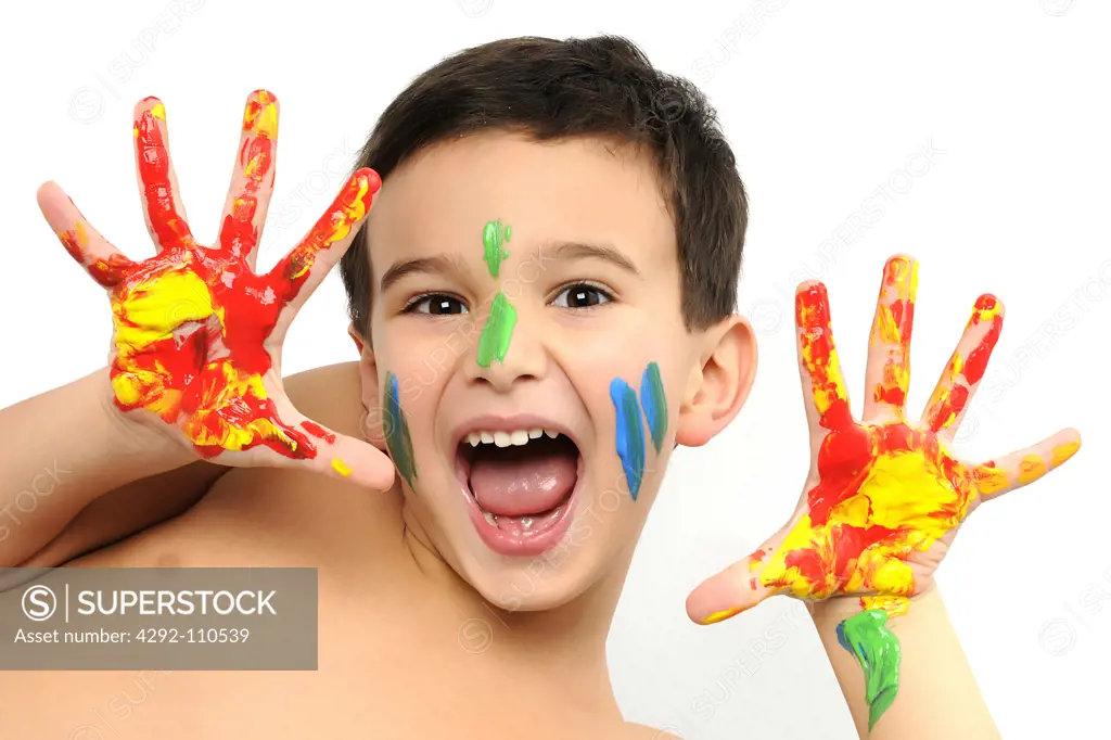 Young boy with painted hands