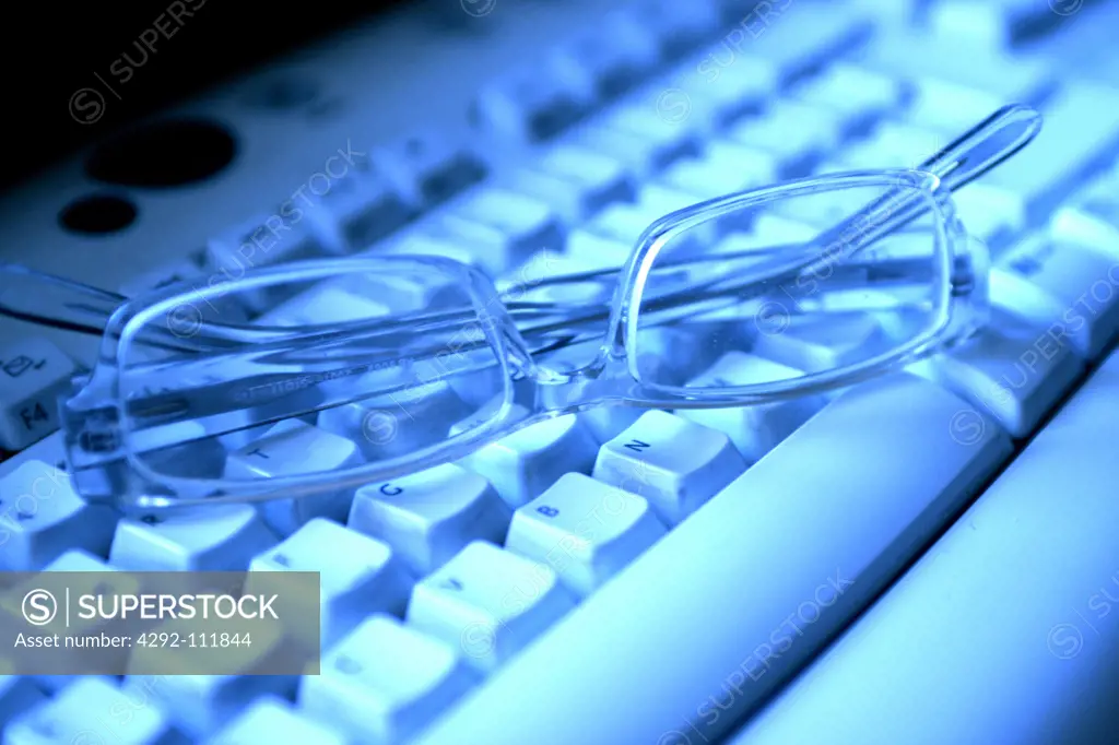 Eyeglasses on computer keyboard