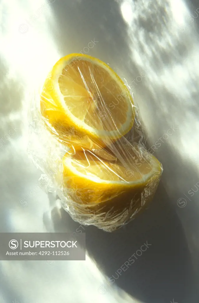 Lemon in plastic wrap