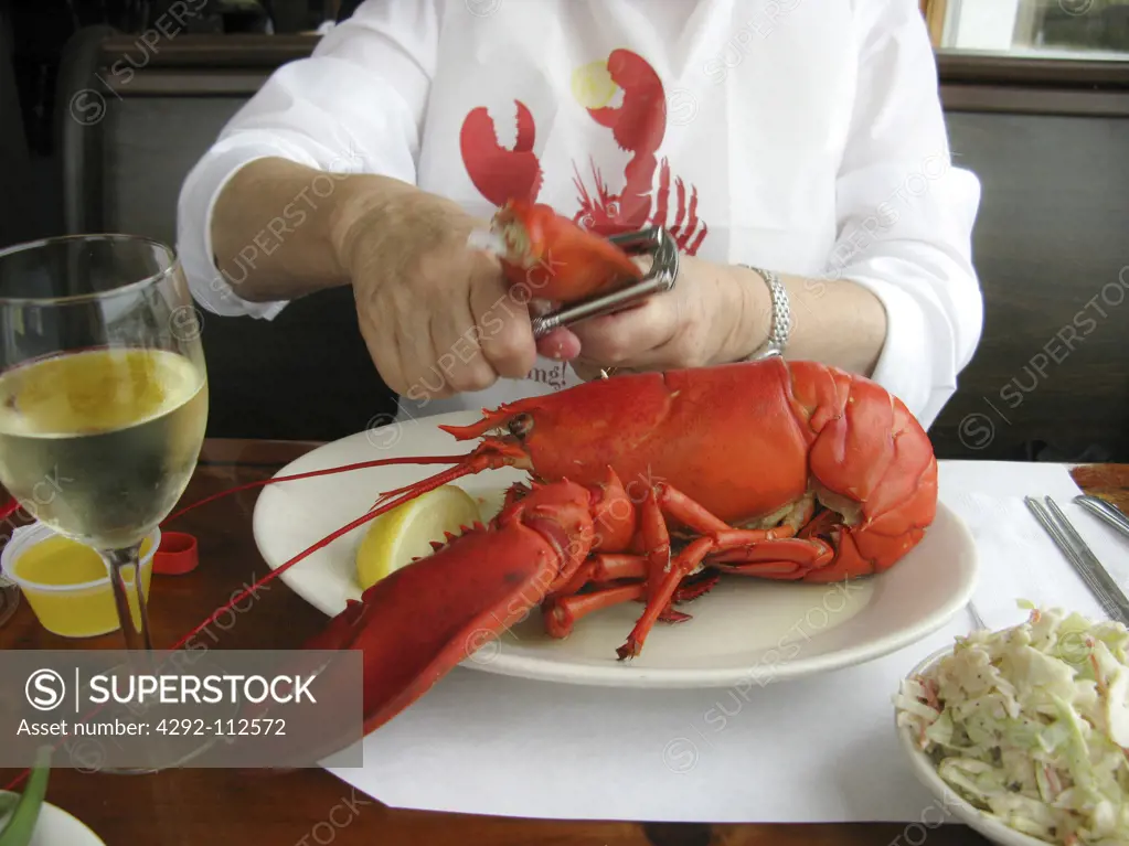 Woman eating lobster