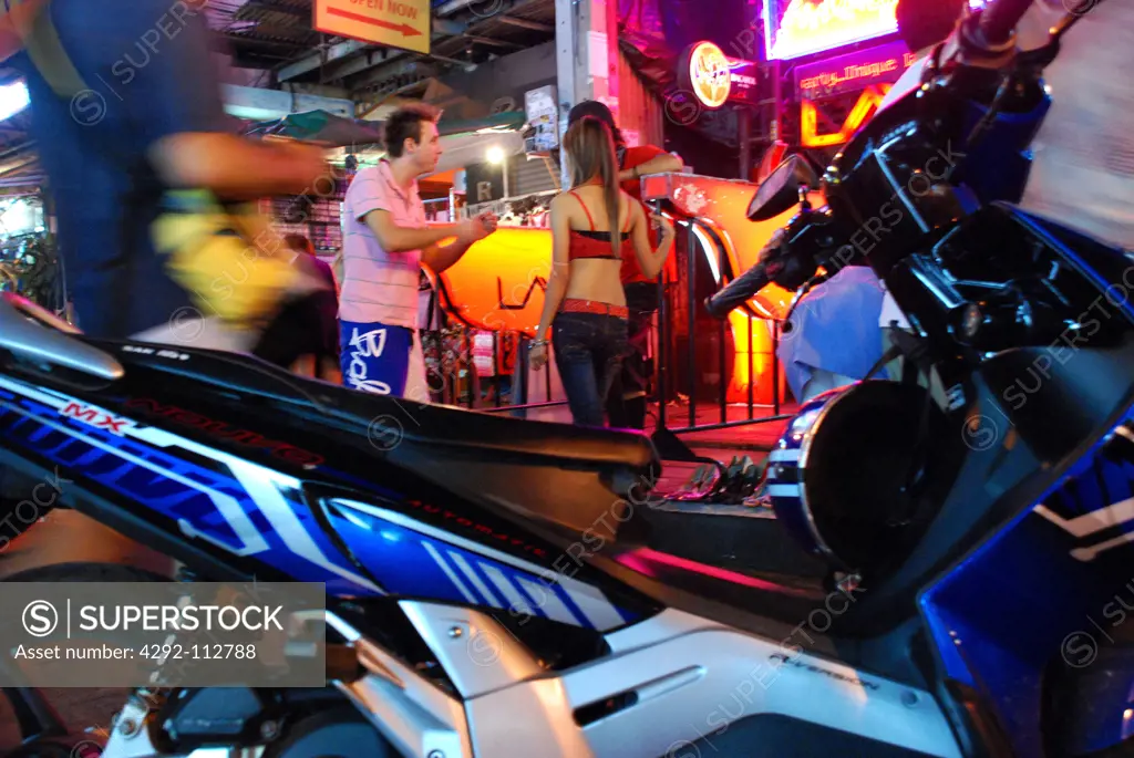 Thailand, Bangkok, View of a Motorcycle, Nightclub Employees, Western Tourists.