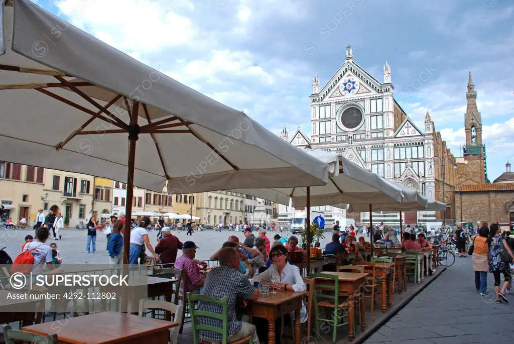 Tuscany, Florence, Santa Croce Church, People having dinner in Santa Croce Square.