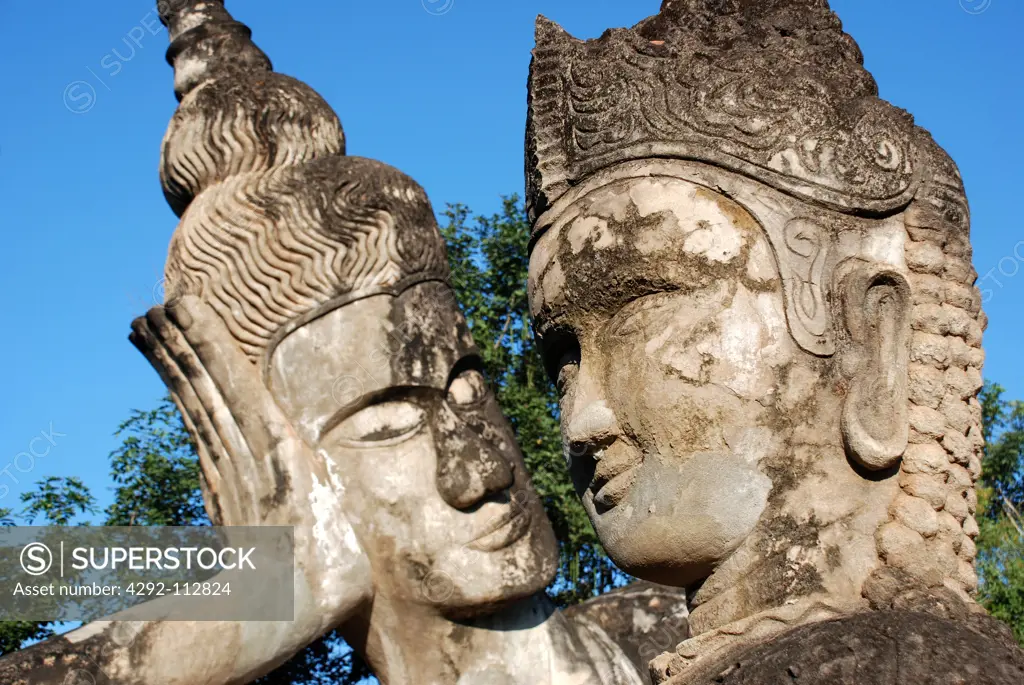 Laos, Vientiane, Faces of Buddha Sculptures at Xieng Khuan, Aka Buddha Park.