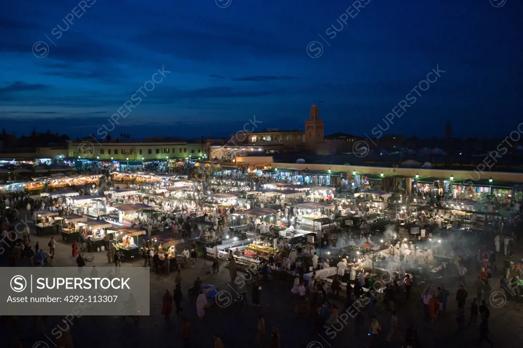 Africa, Morocco, Marrakech. Jemaa el Fna square, crowd and foodstalls
