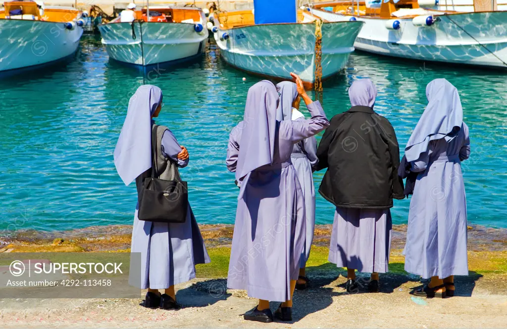 Italy, Campania, Capri, nuns in Marina Grande harbour