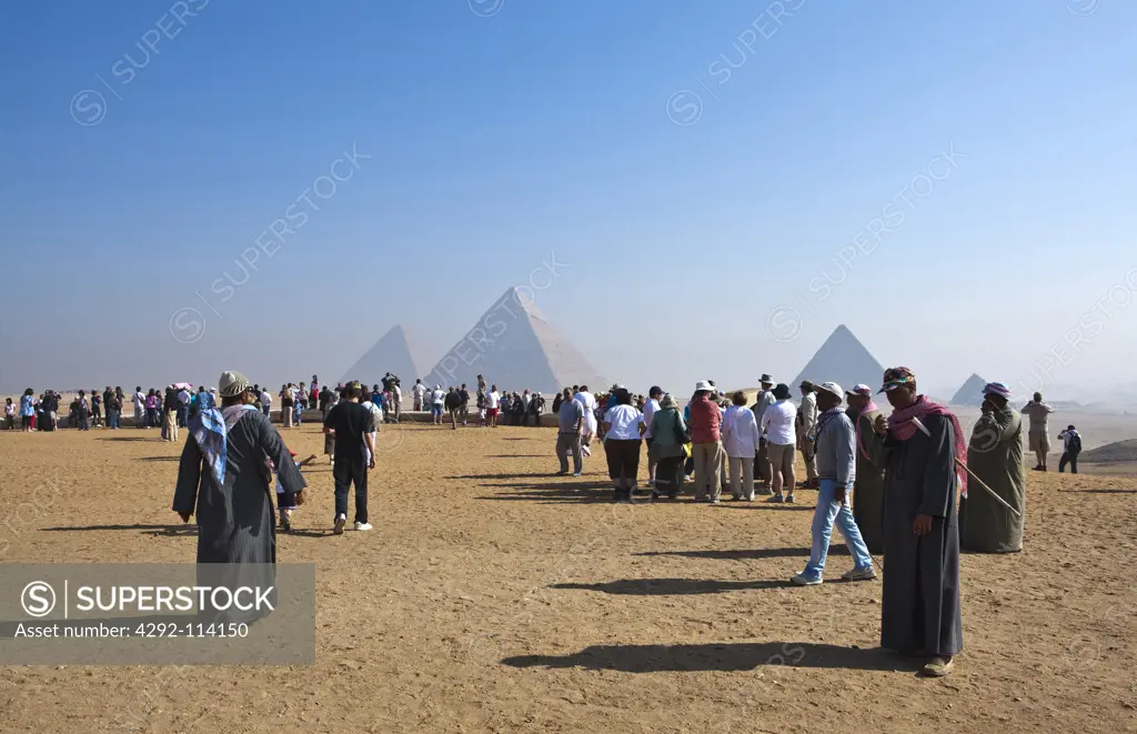 Egypt, Cairo. Giza Pyramids, Cheops,Chepren and Mycerinus with tourists