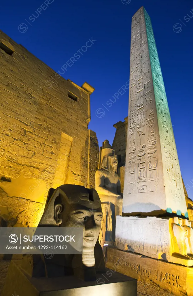 Egypt, Luxor, Temple of Luxor with Ramses statue at night