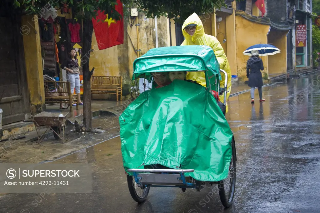 Asia, Vietnam, Hoi An, rickshaw under the rain