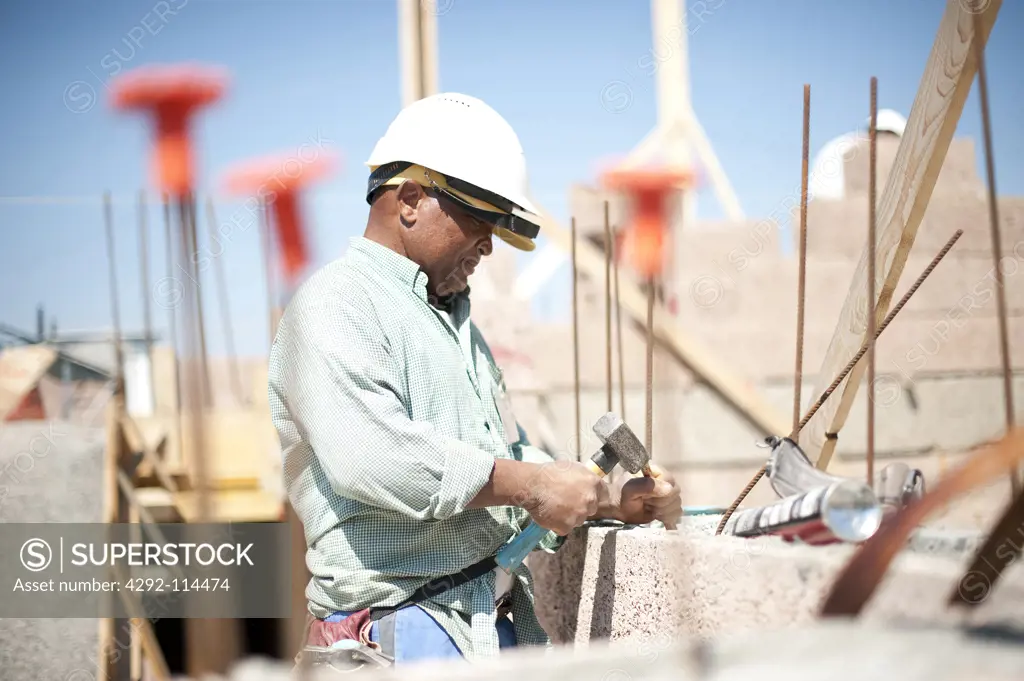 Construction workers standing at a construction site