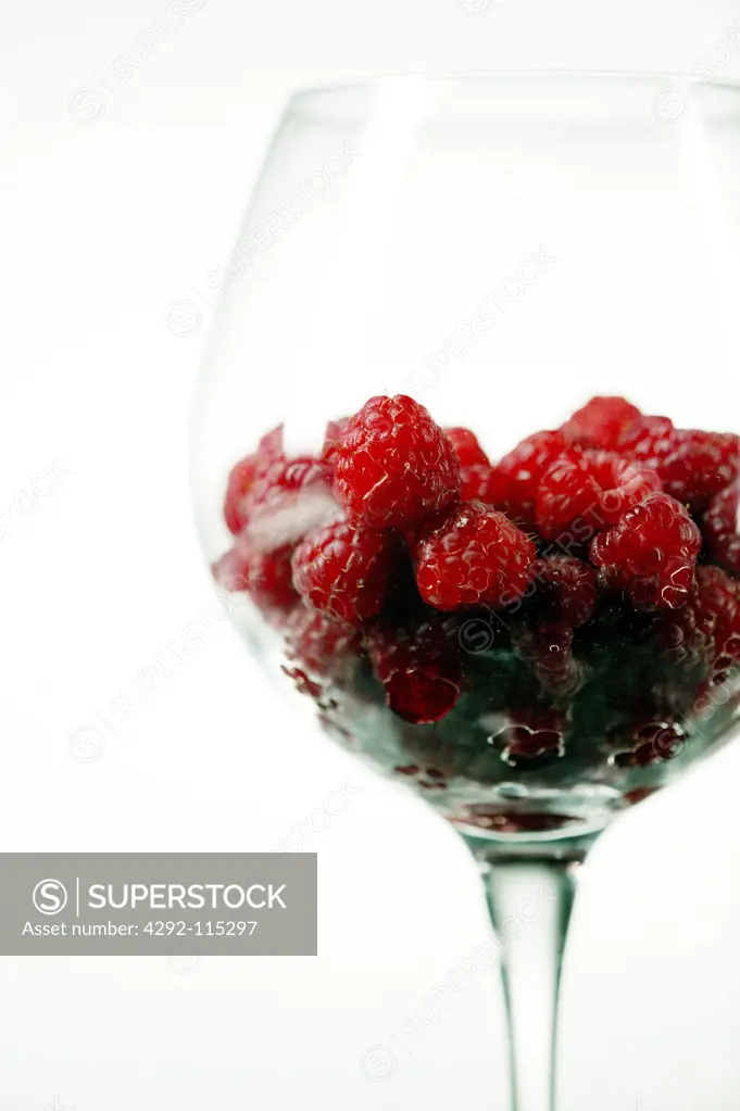 Tumbler full of raspberries