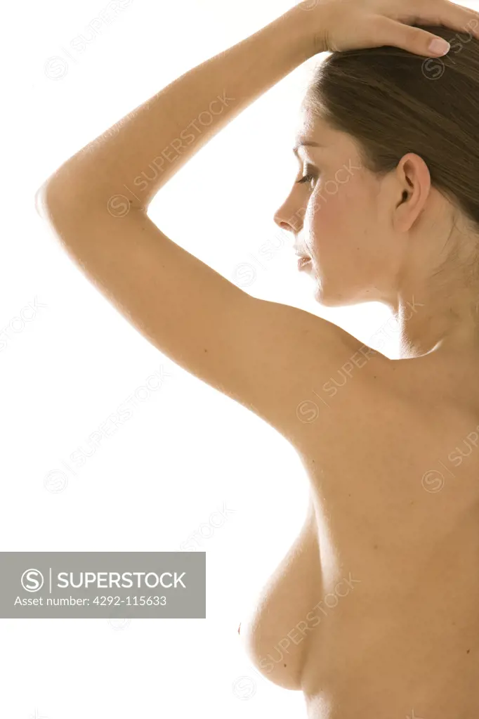 Profile of woman with hand on her head