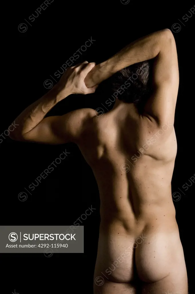 Studio shot of a man stretching arms