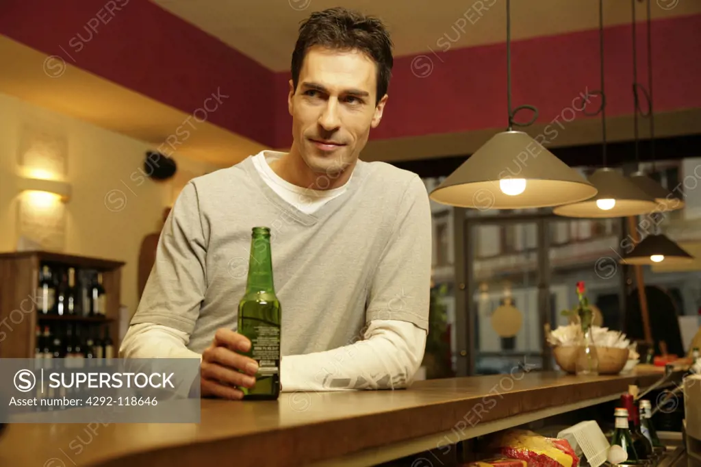 Man in a bar having beer