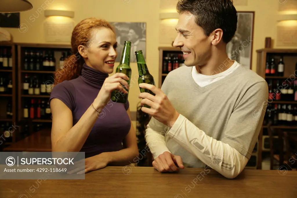 Couple in a bar having beer