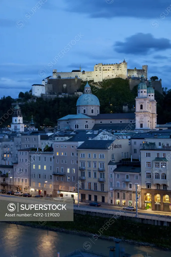 Austria, Salzburg, Hohensalzburg castle and town at dusk